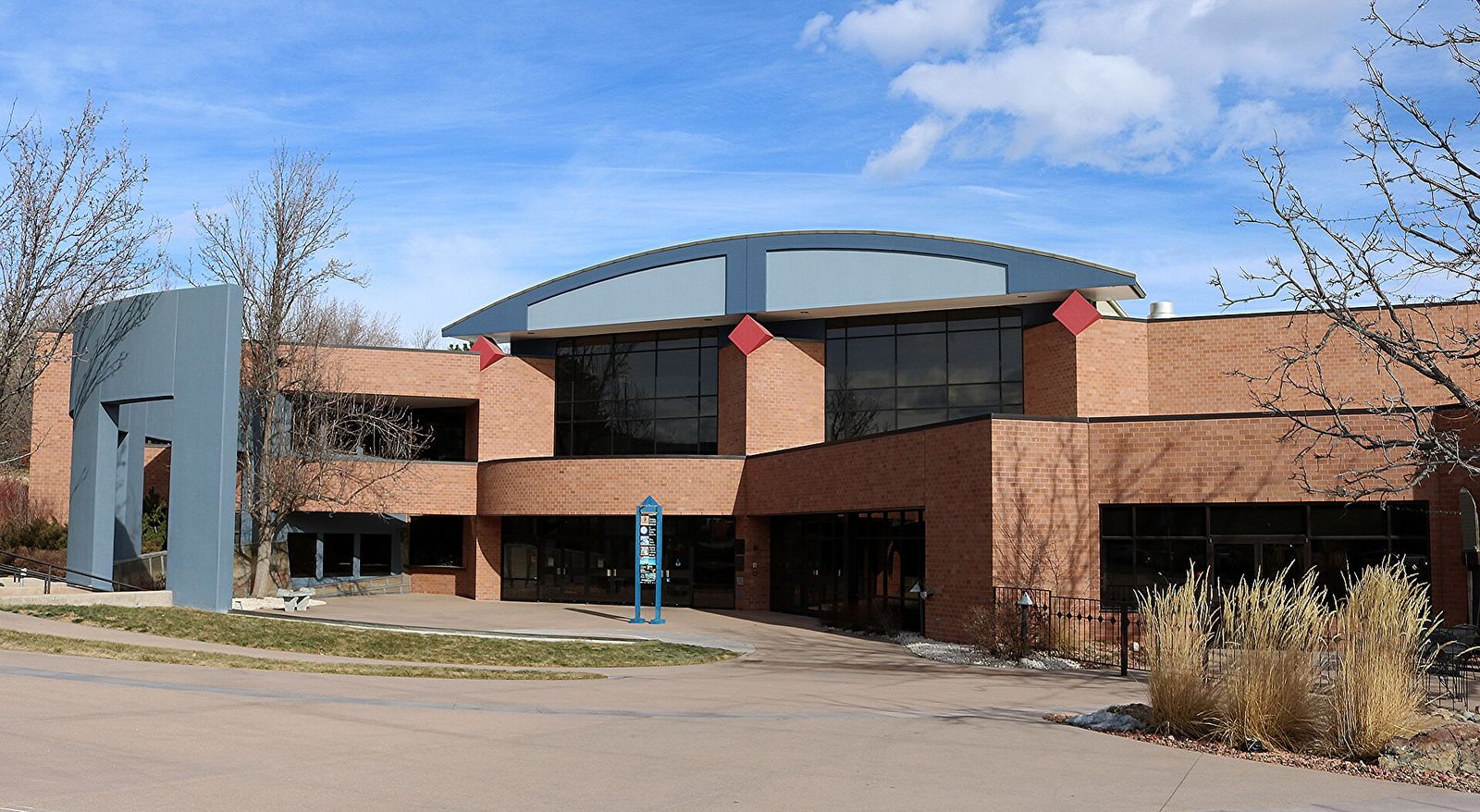 Arvada Center for the Arts and Humanities building with a curved roof and outdoor sculpture