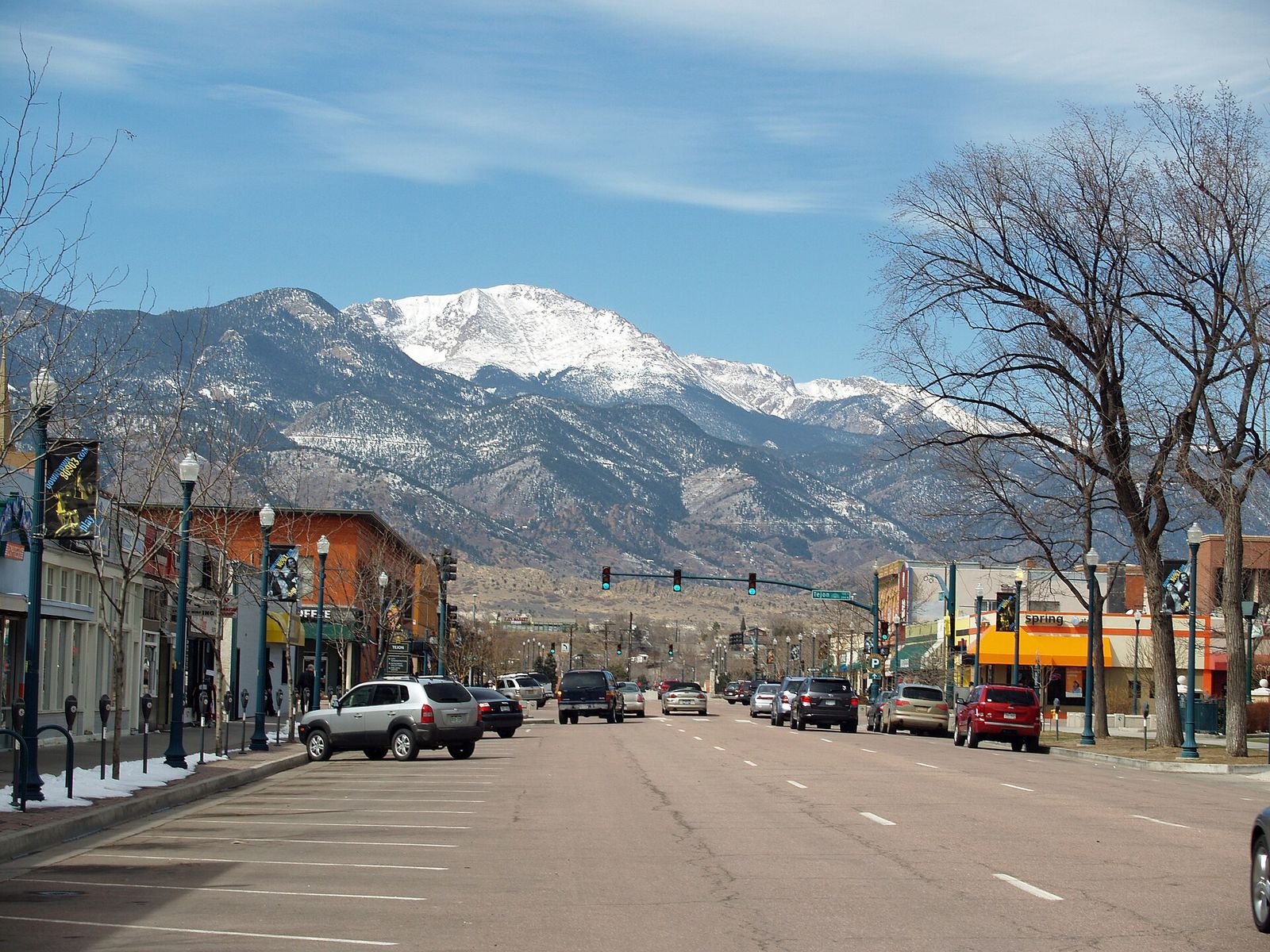 Pikes Peak Avenue in downtown Colorado Springs with snow-capped Pikes Peak at the end of the street