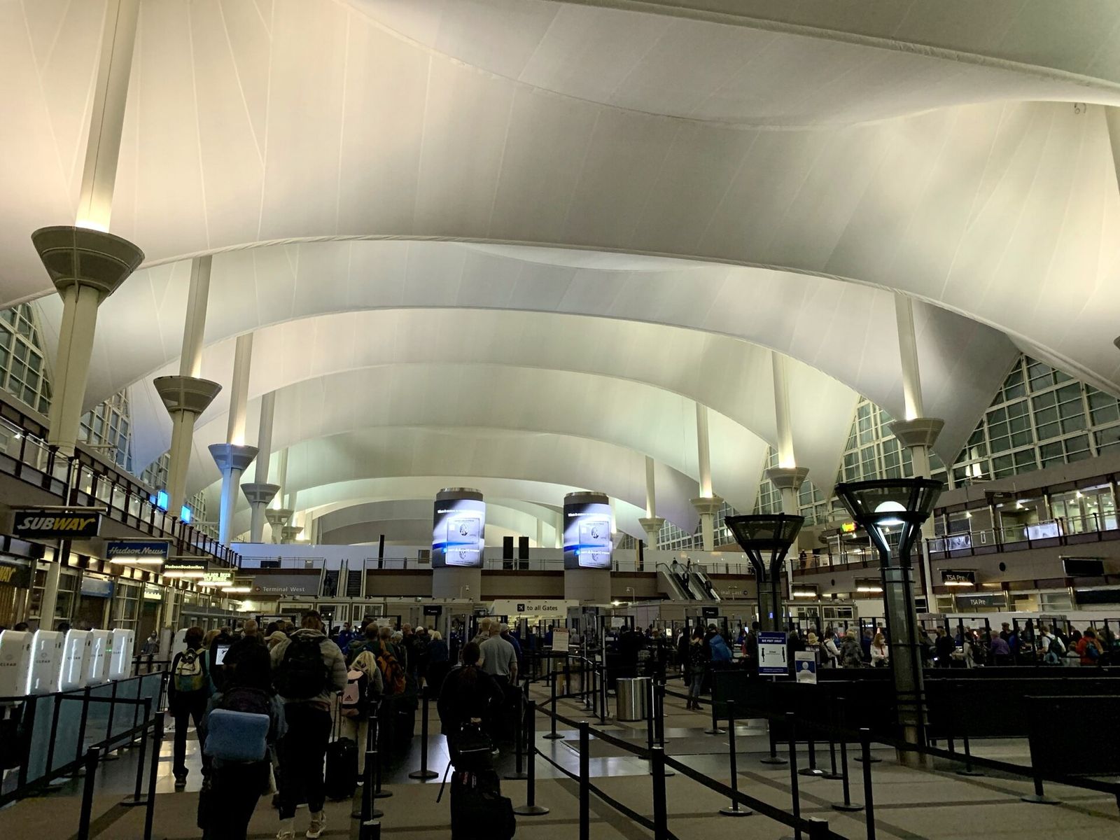 Security screening hall inside Denver International Airport's main terminal
