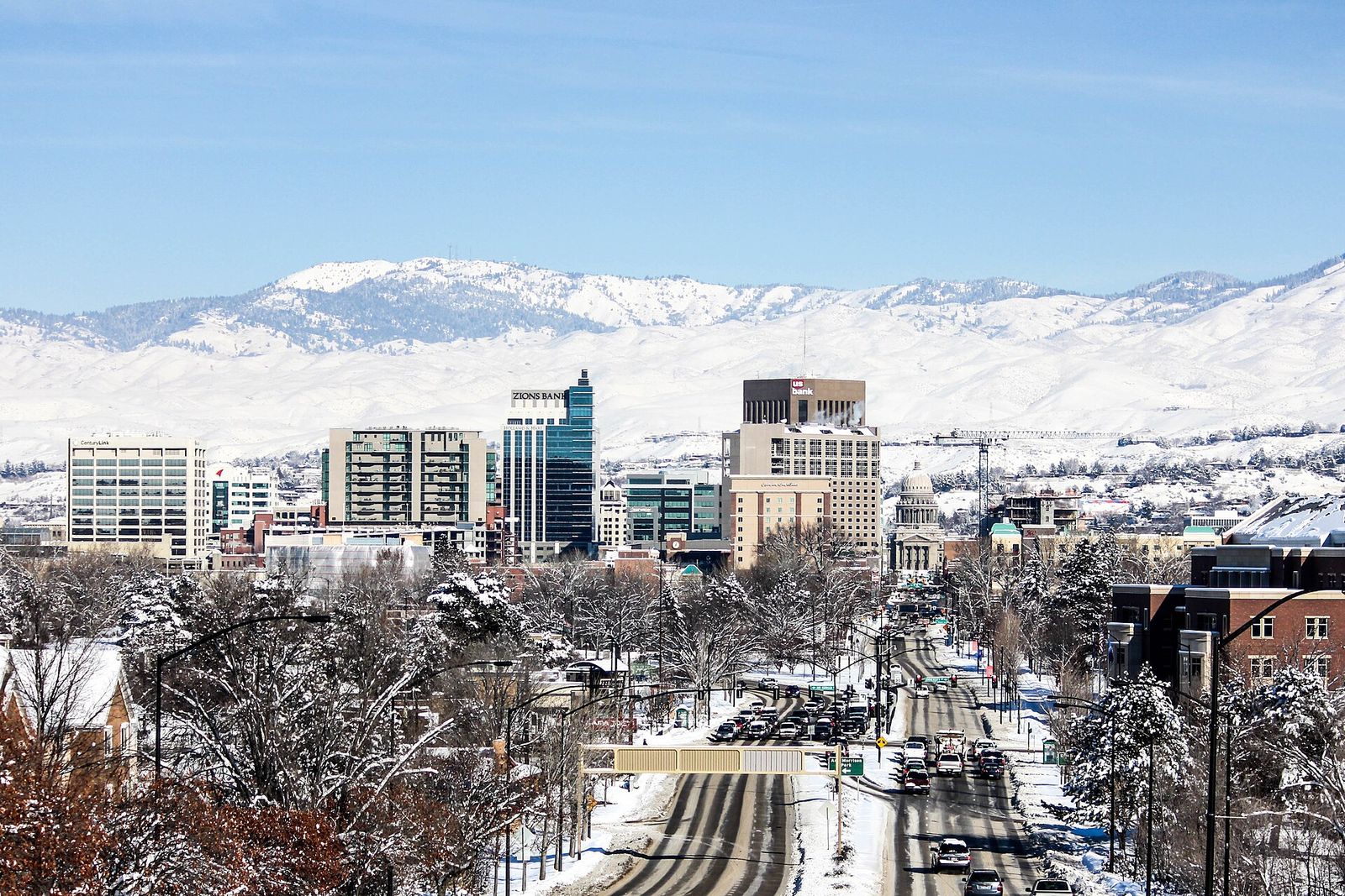 Downtown Boise buildings with snow-covered foothills behind them in winter