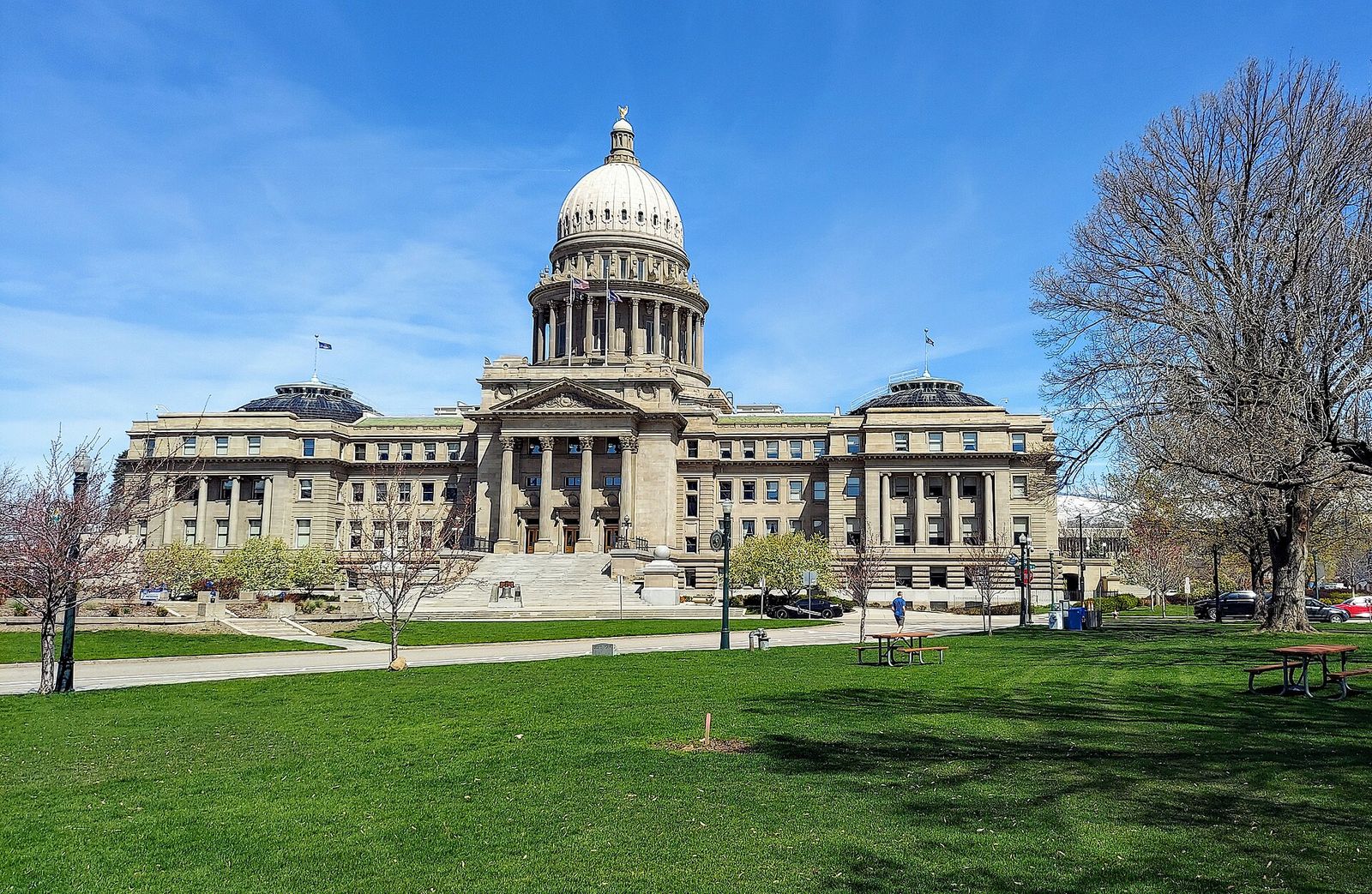 Idaho State Capitol in Boise with its white dome above a green lawn