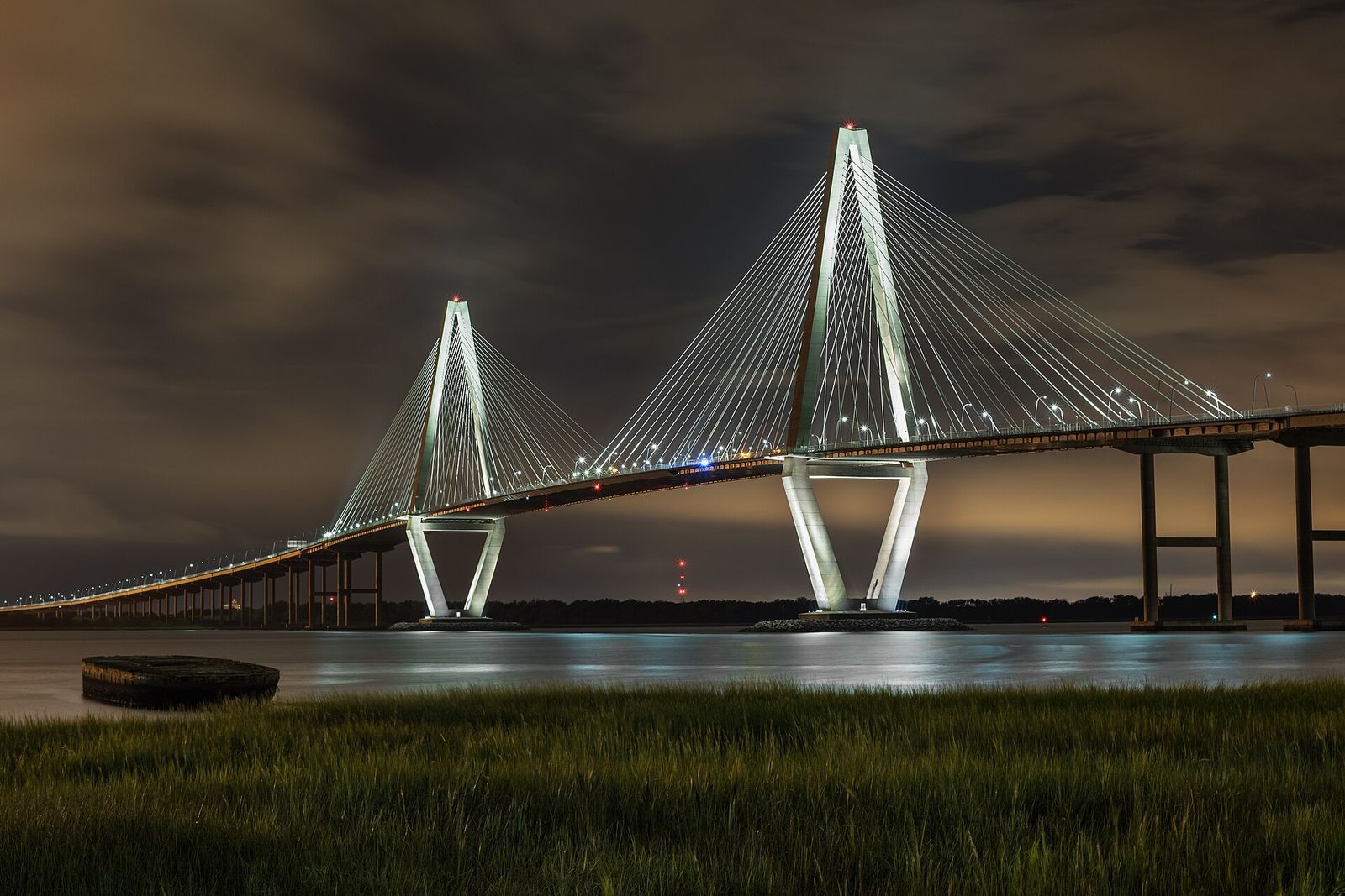 Arthur Ravenel Jr. Bridge lit at night over the Cooper River, seen from Mount Pleasant