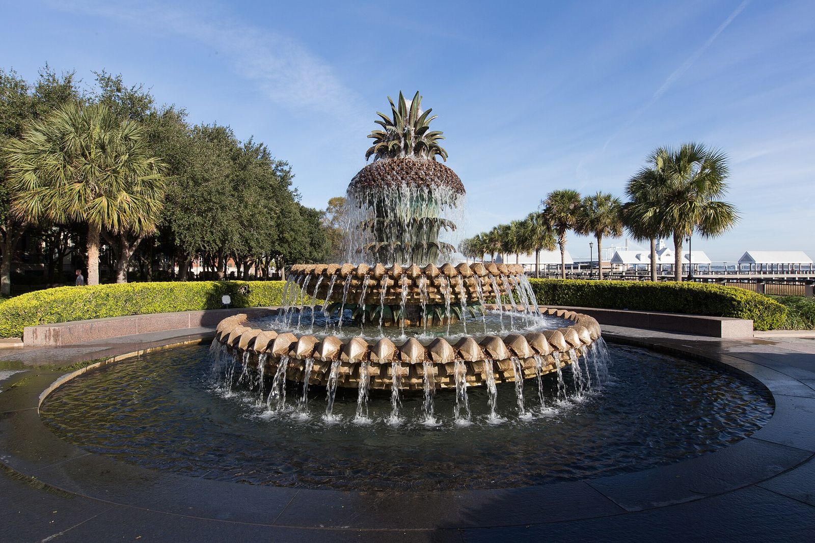 Pineapple Fountain surrounded by palmettos at Waterfront Park in Charleston