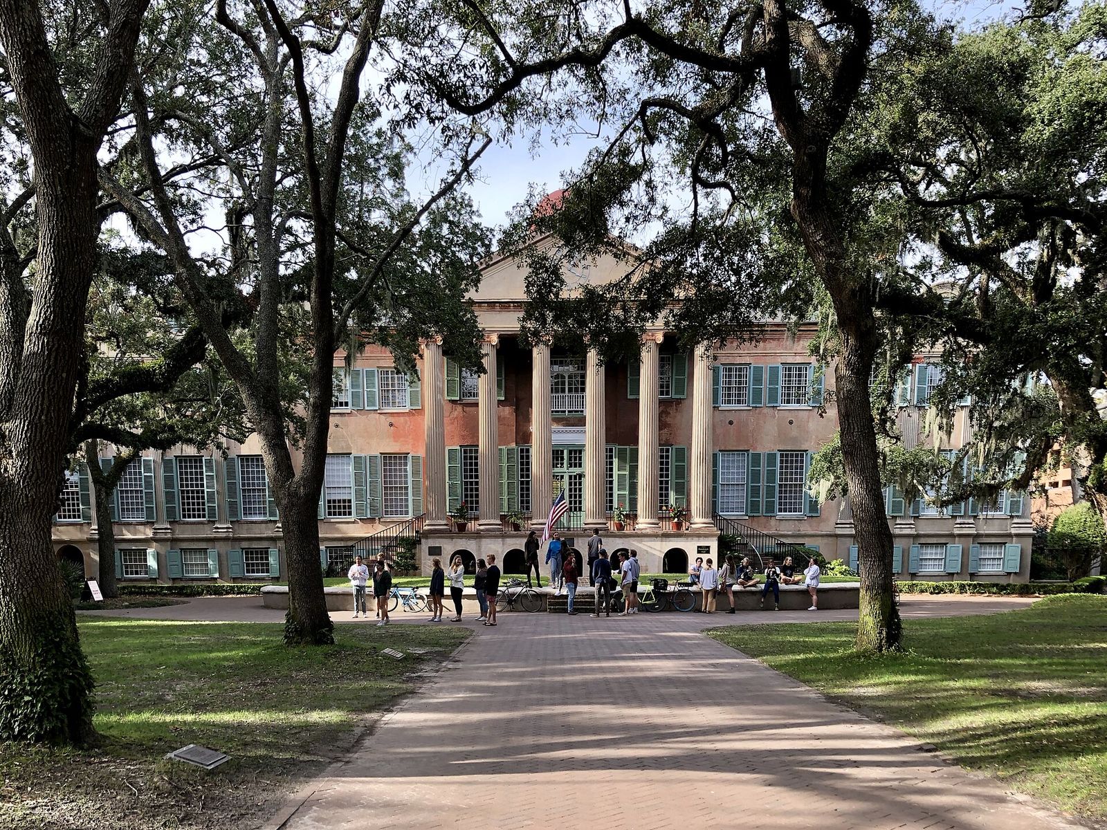 Randolph Hall with its columned portico under oak trees at the College of Charleston