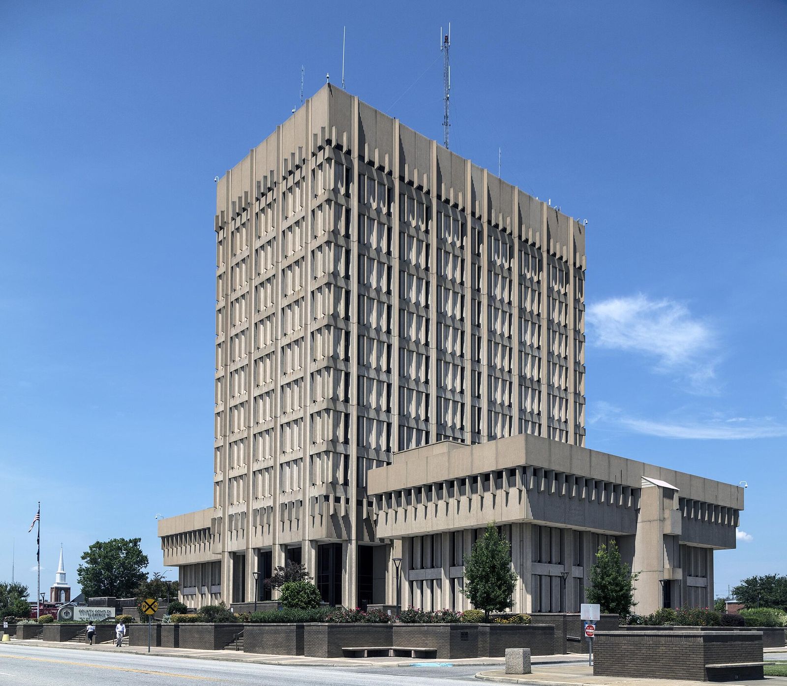 Tall modernist Florence County government complex under a clear sky