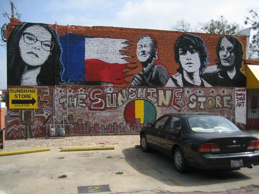 Painted mural with a Texas flag on a brick building in Deep Ellum