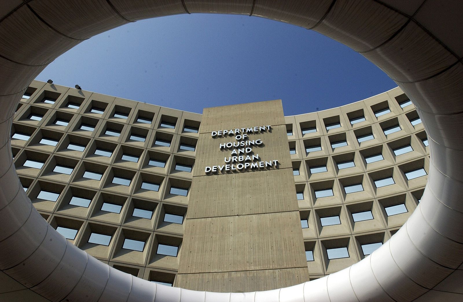 Department of Housing and Urban Development sign seen through a circular concrete opening
