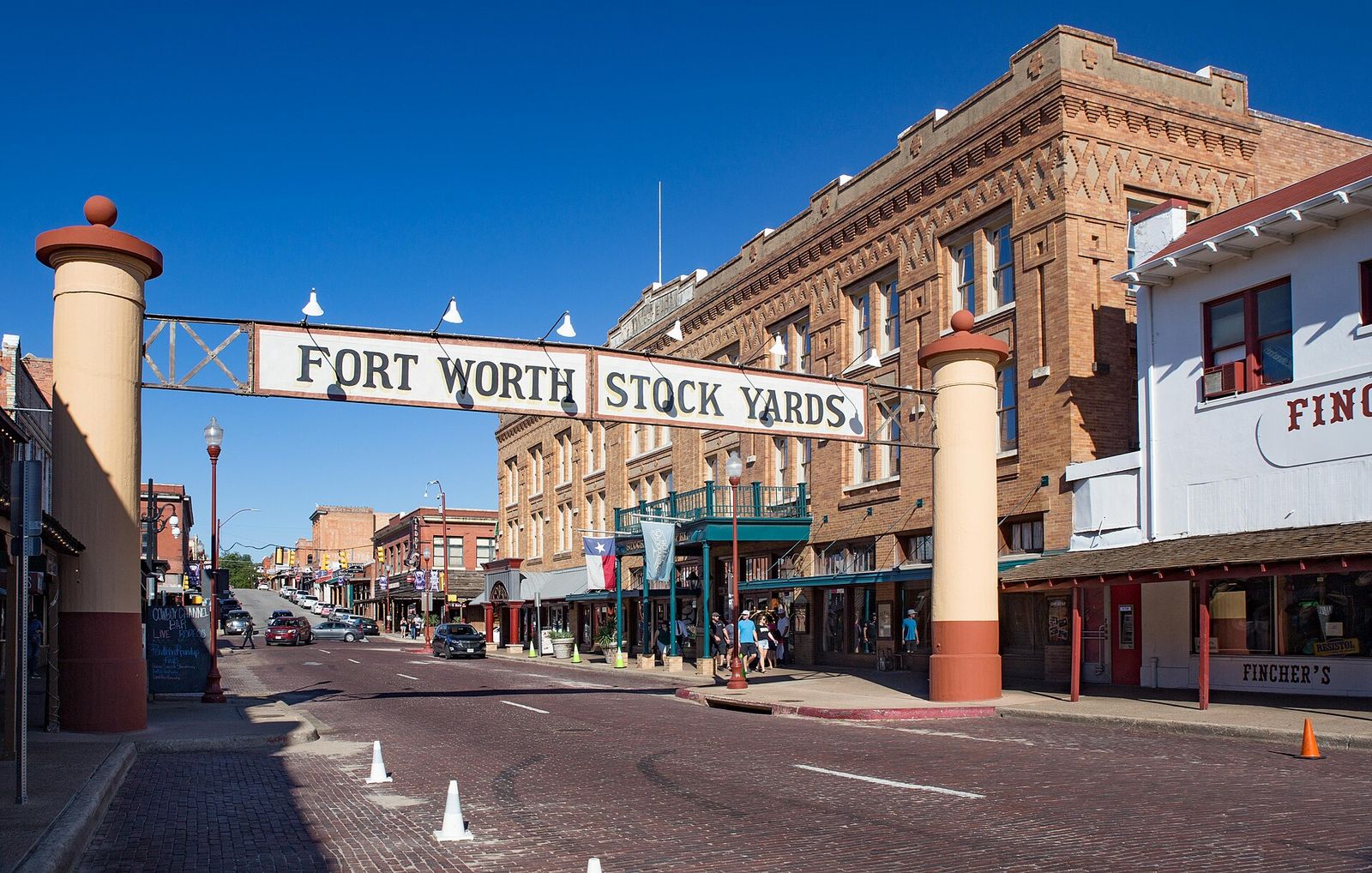 Fort Worth Stock Yards sign arching over Exchange Avenue with historic brick buildings
