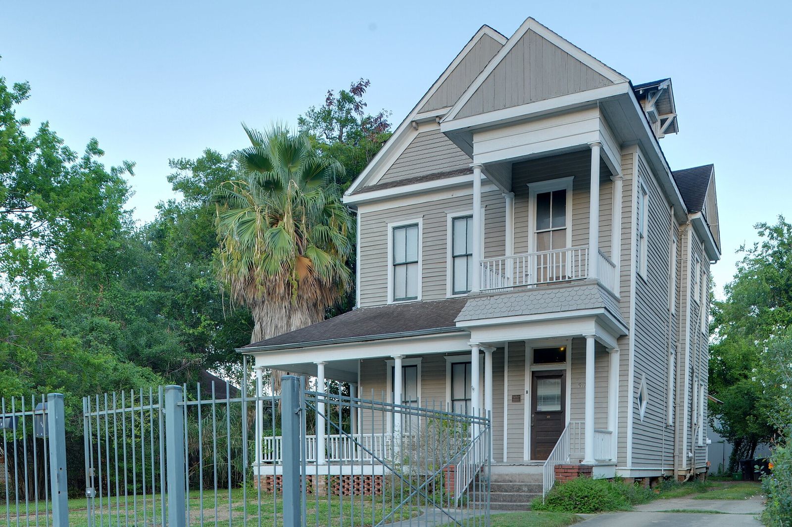 Restored Victorian house with a wraparound porch on Heights Boulevard in Houston