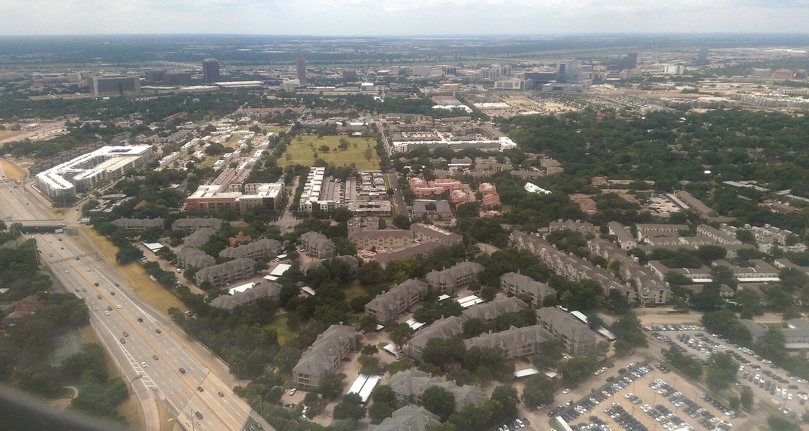 Aerial view of apartment complexes and a highway in the Dallas area