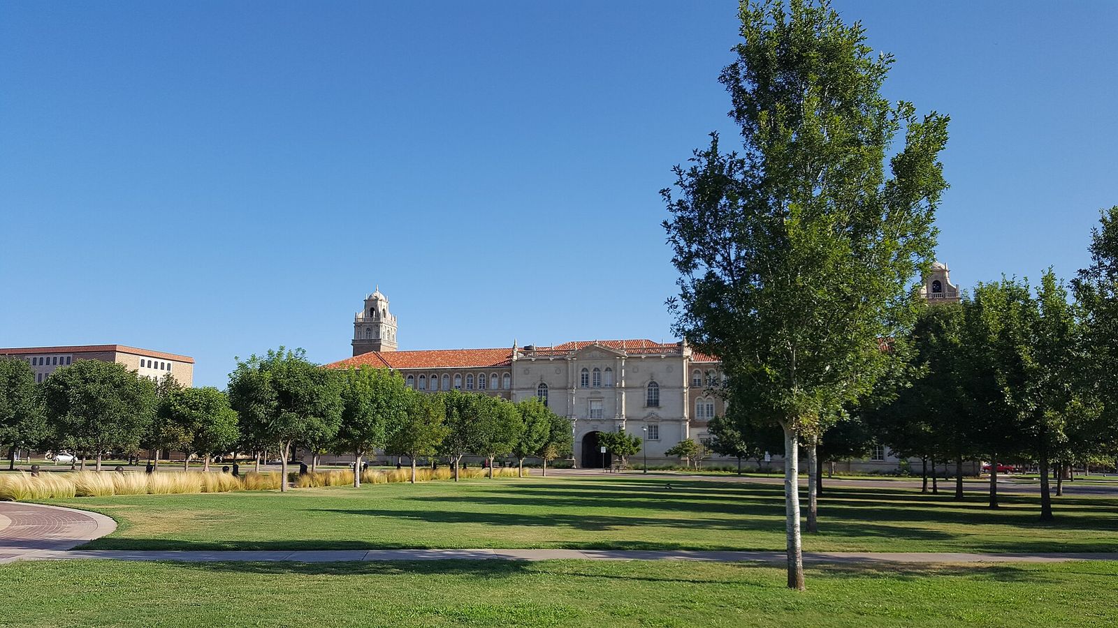 Texas Tech University Administration Building with its bell tower behind green lawns