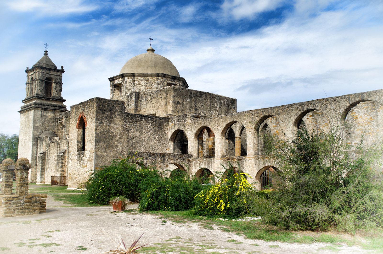 Stone church and bell tower of Mission San José in San Antonio