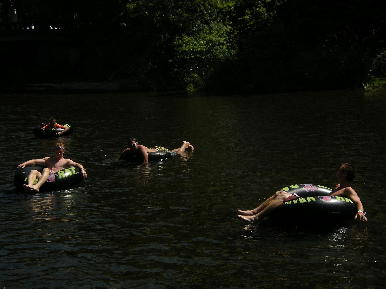People floating on the Cedar River in Renton on a summer day