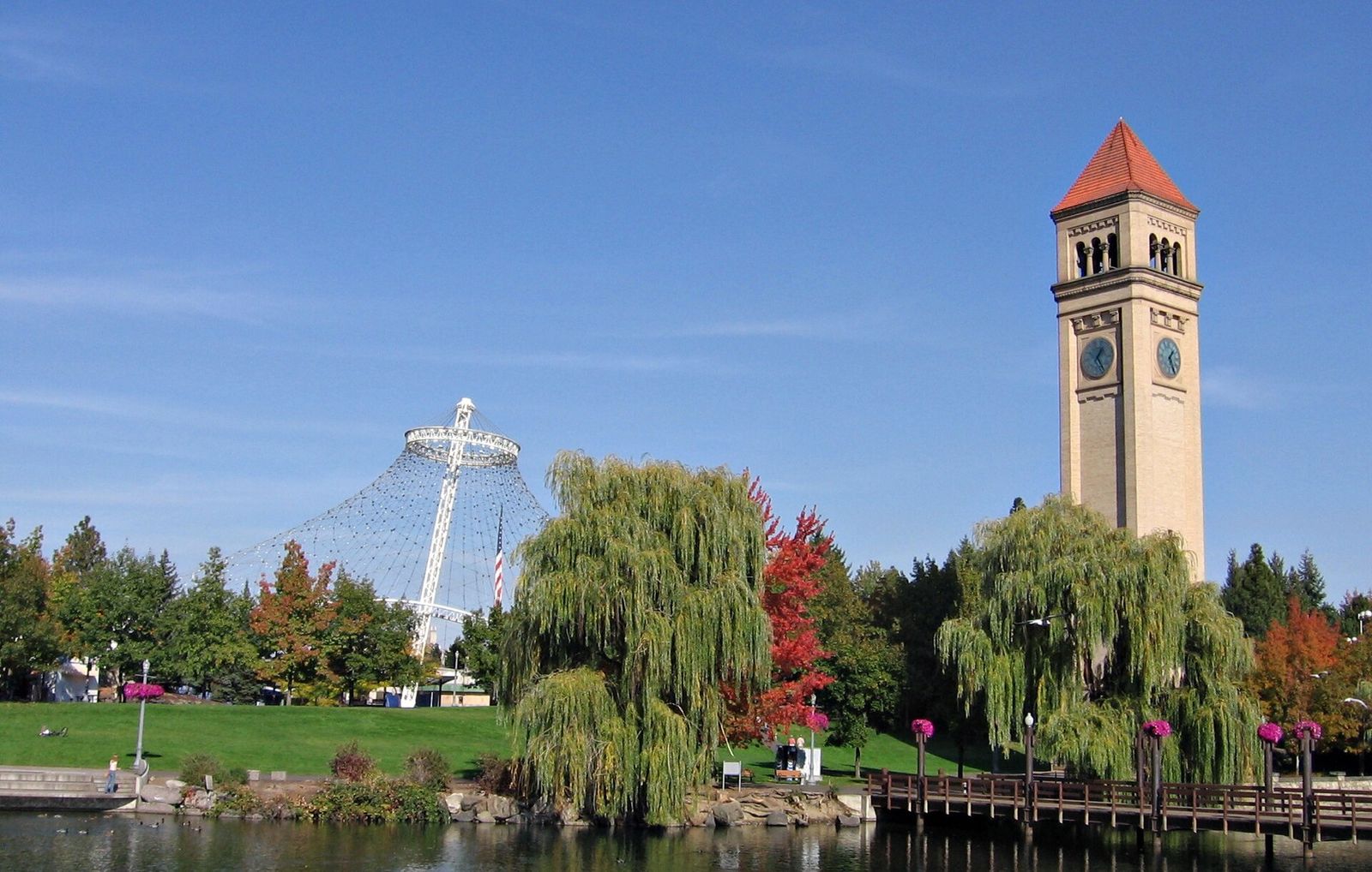 The Great Northern clock tower in Riverfront Park with autumn color along the river