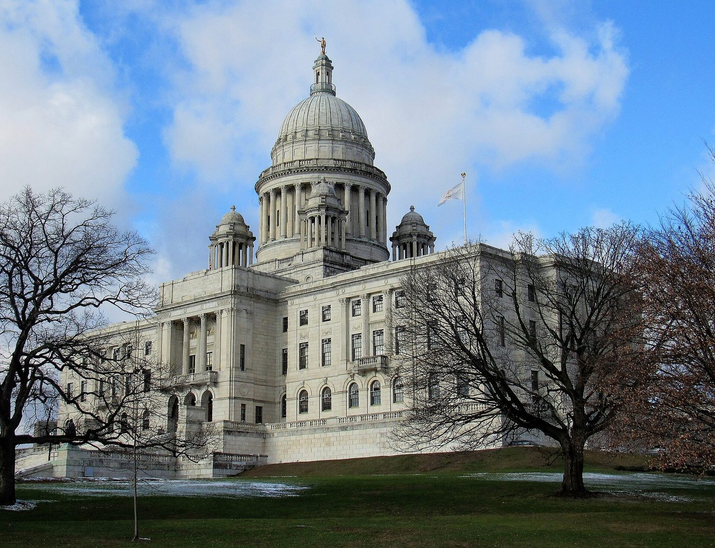 The Rhode Island State House in Providence beneath a bright winter sky