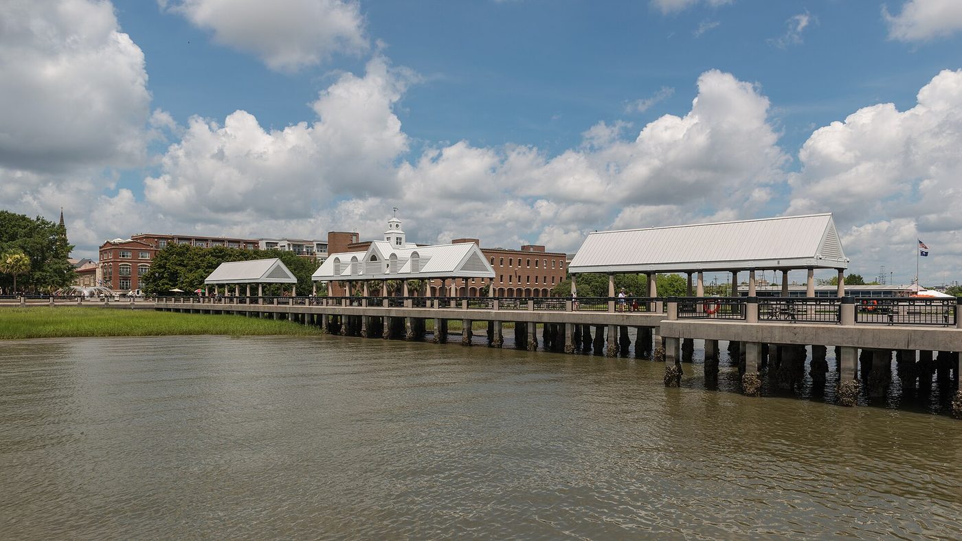 The wharf and pavilions of Charleston's waterfront under summer cloud